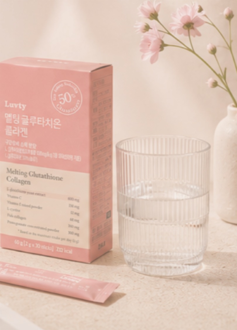Luvty collagen supplement styled with a glass of water and cherry blossoms